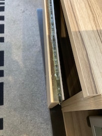 finger grip on cupboard door ,, engrained with dust in groove!