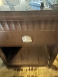 Layer of dust on nightstand