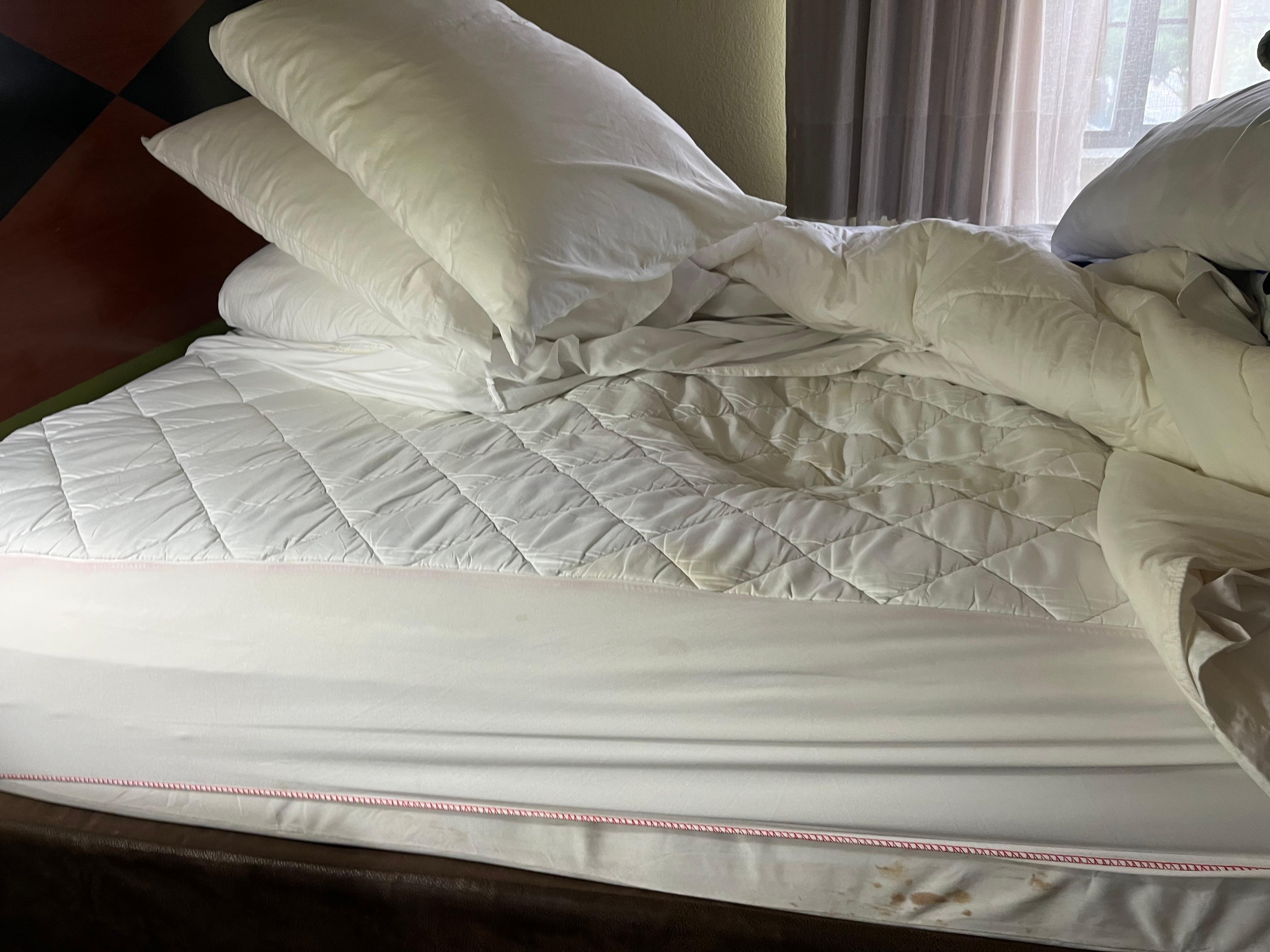 Sunken area of mattress and stains 