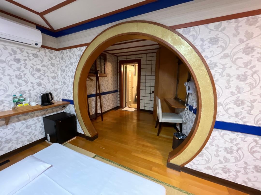 Hall way to washroom which also contain a small hot spring tub.