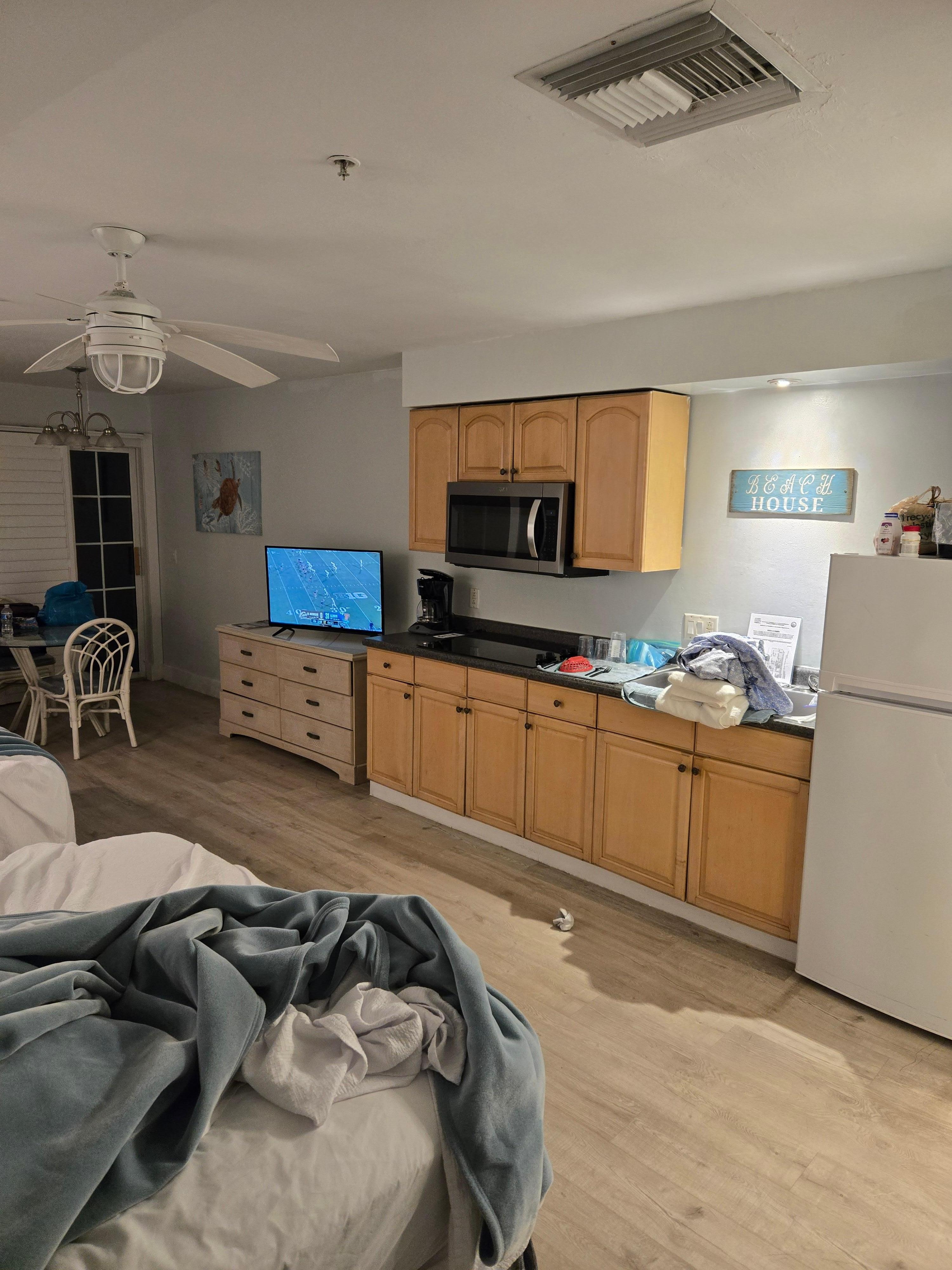 Full kitchen. Pots, pans, cups, plates, silverware. 