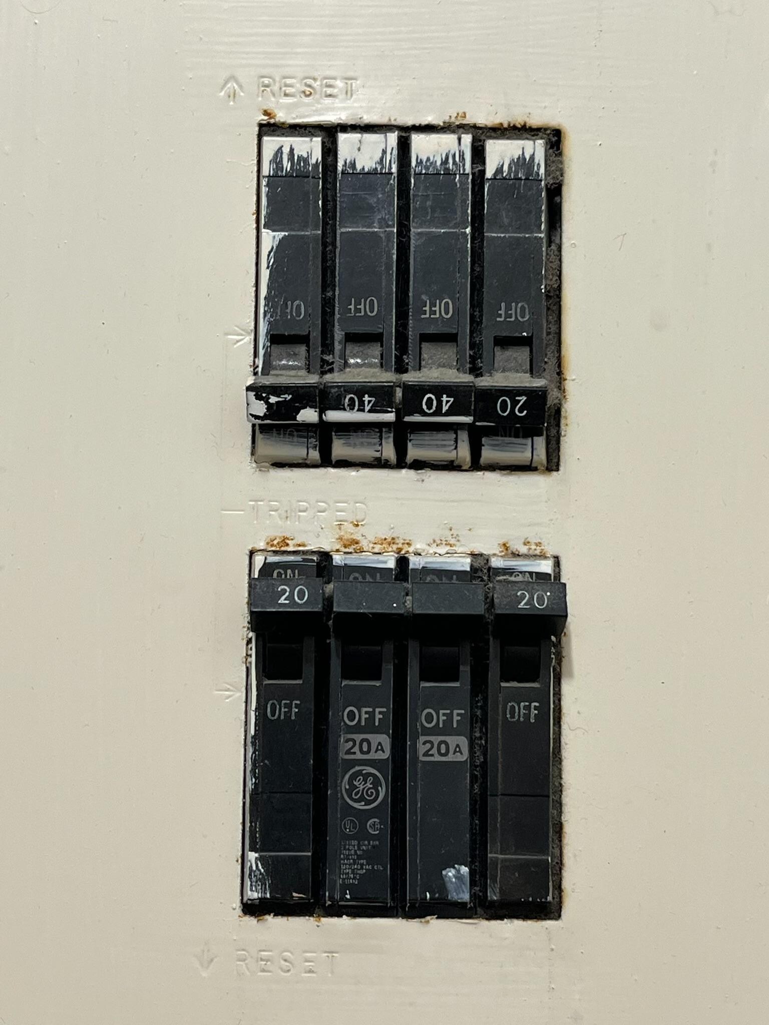 There’s not a zoomed out photo but this exposed and uncovered electrical panel is 8 inches away from the shower!