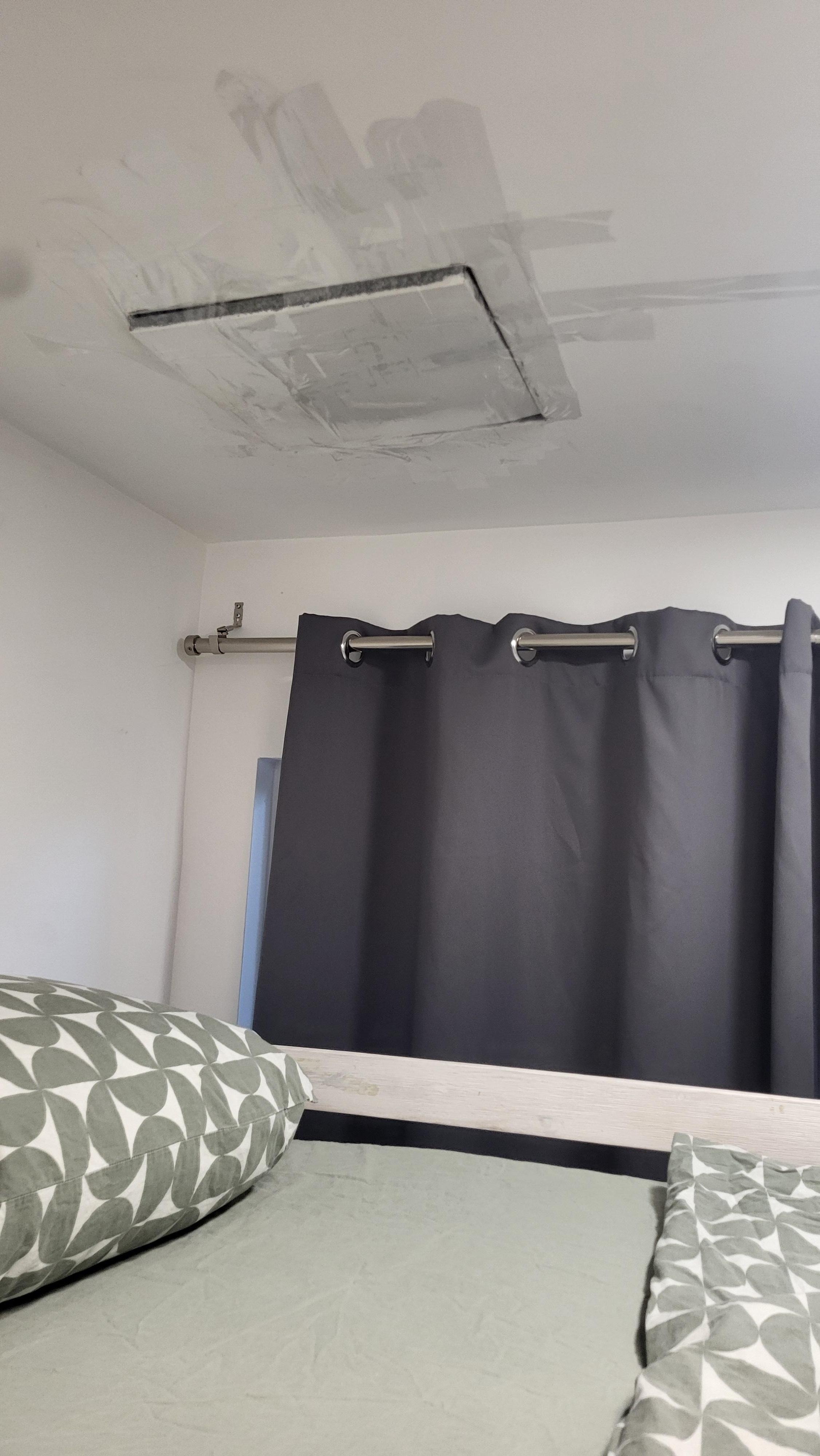 The ceiling in guest room, held up with packing tape