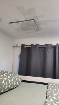 The ceiling in guest room, held up with packing tape