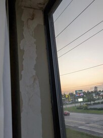 Peeling paint in window sill.