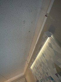 Half finished trim work and open wall anchors