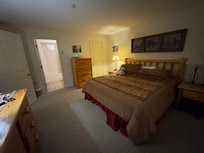 Large bedroom with plenty of drawer space and a king bed