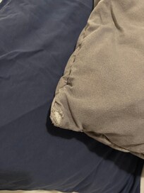 Worn bed linens