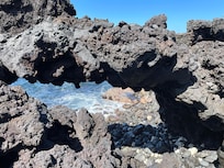 View along the volcanic rock ledge