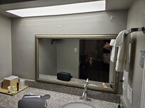 The bathroom mirror must have been taken down or fell. It was propped up behind the bathroom faucet! We had to keep leaning down to see yourself. My wife had to sit in a chair to curl her hair!