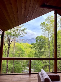 View from the deck. Very comfortable deck furniture & outside gas fireplace. The weather was perfect!