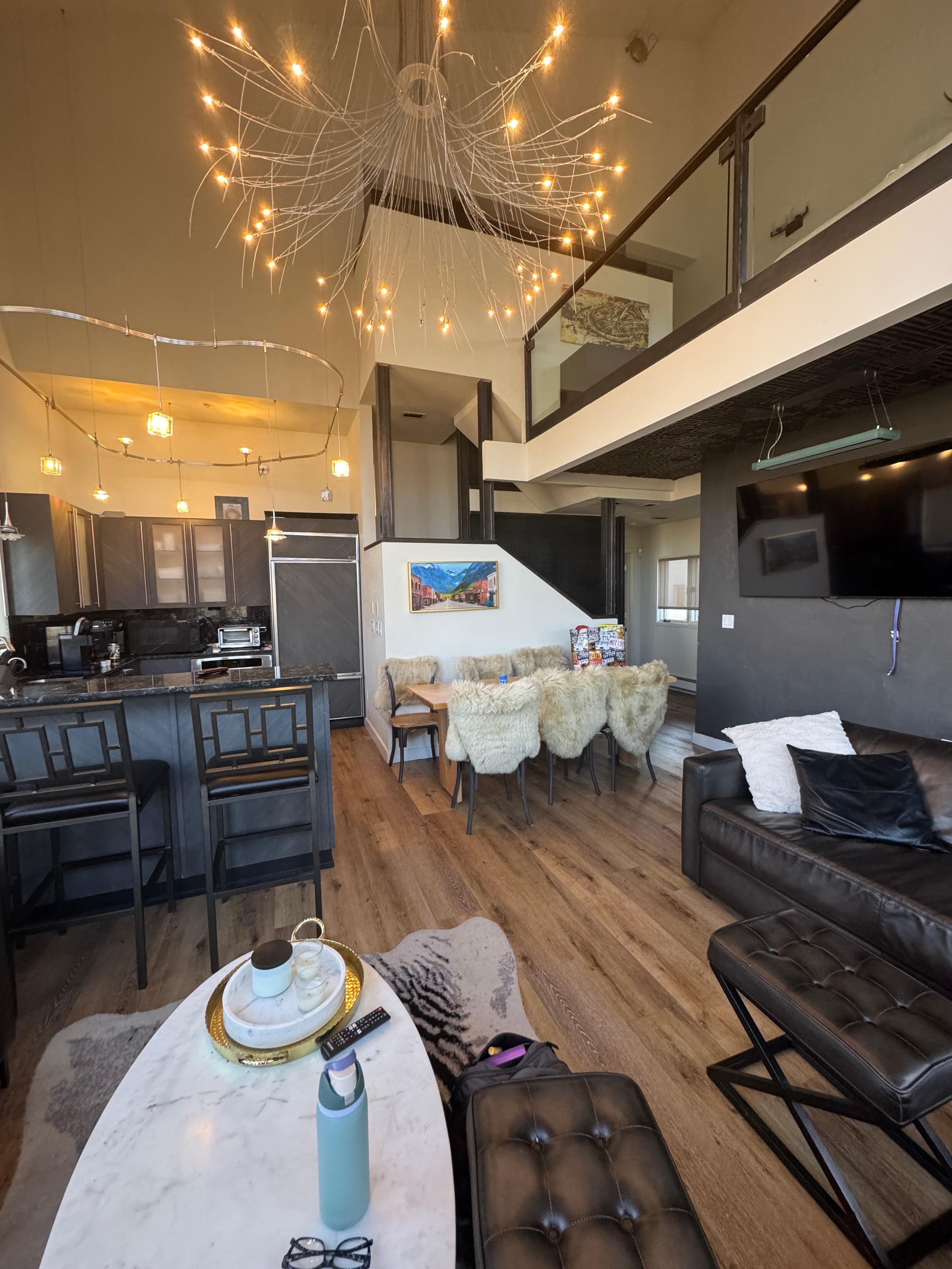 Main floor with kitchen, table, and seating area.  