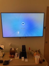 Broken television (image 1) not repaired despite frequent requests during stay
