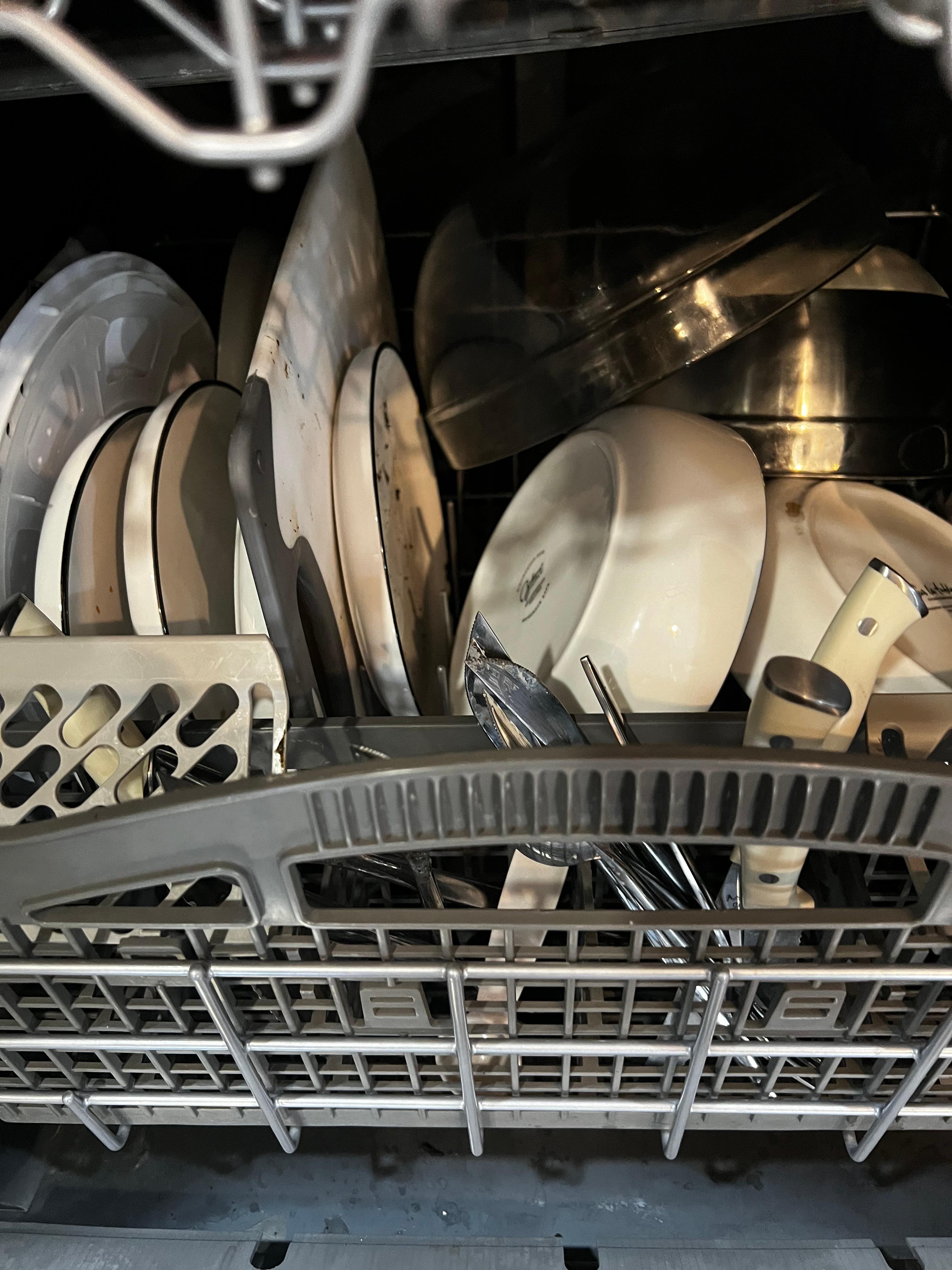 Dirty dishes in the dish washer.