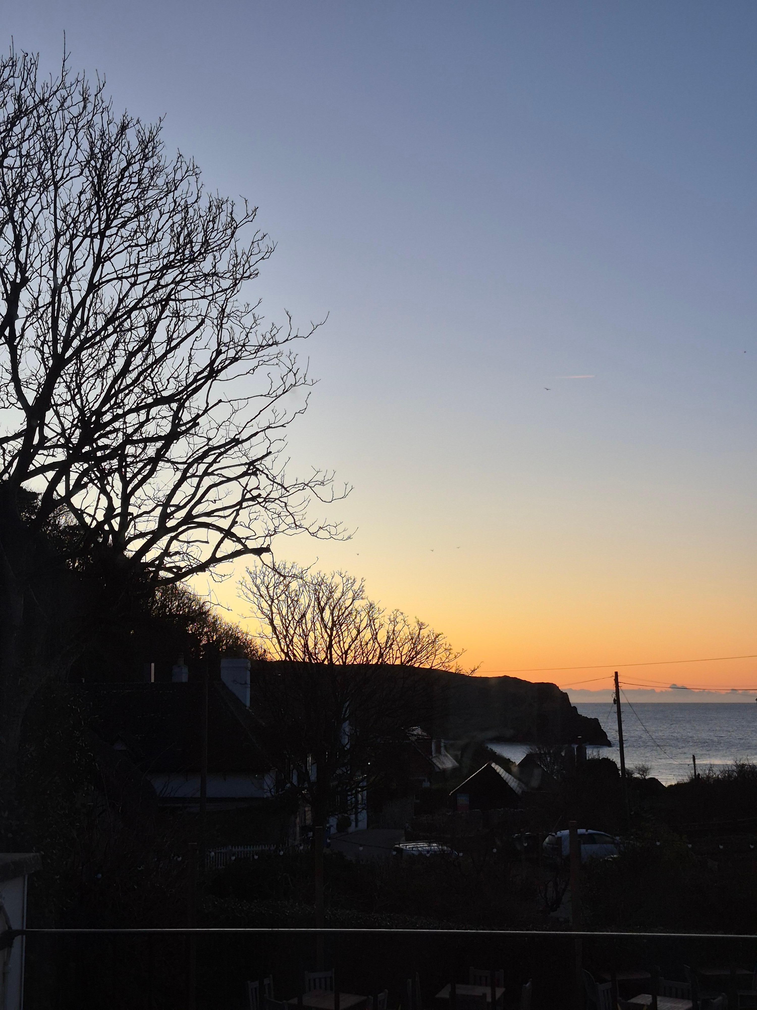 View from bedroom of Sunset over Lulworth Cove