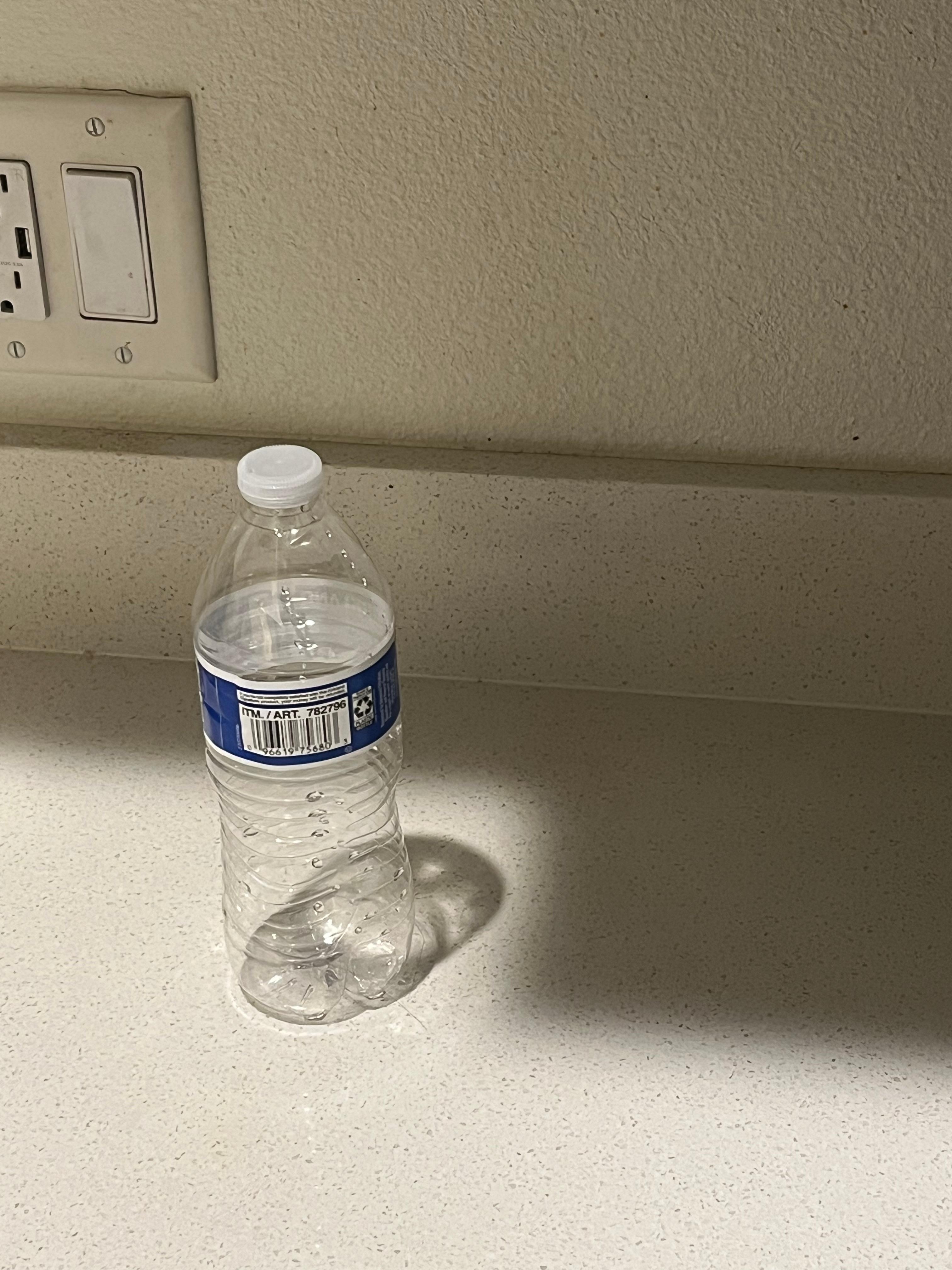 Empty water bottle on counter