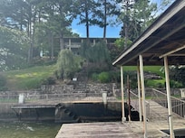 house view from dock, steep slope, but rock steps are very easy to get up and down