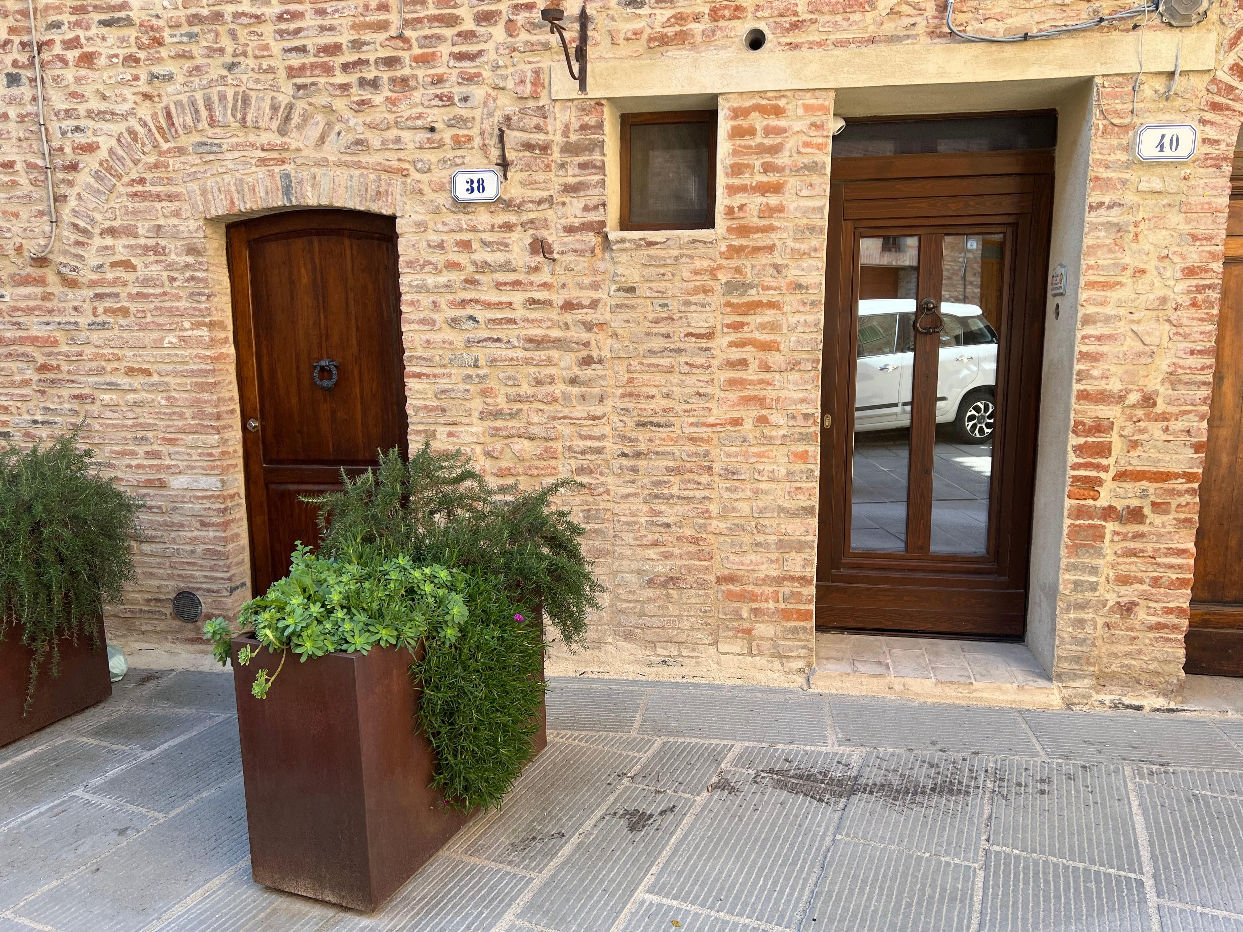Door of the apartment with reflective glass