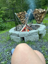 Firepit with plenty of wood provided.