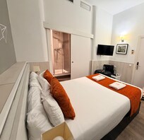 Room was slightly larger than this (a cupboard in the right corner and suitcase wrack) but my husband was in the shot so I cropped it.