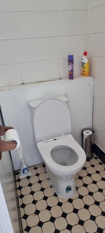 Old and dirty toilet and tiles. Very old amenities.