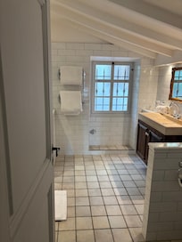 The large bathroom had a double shower.