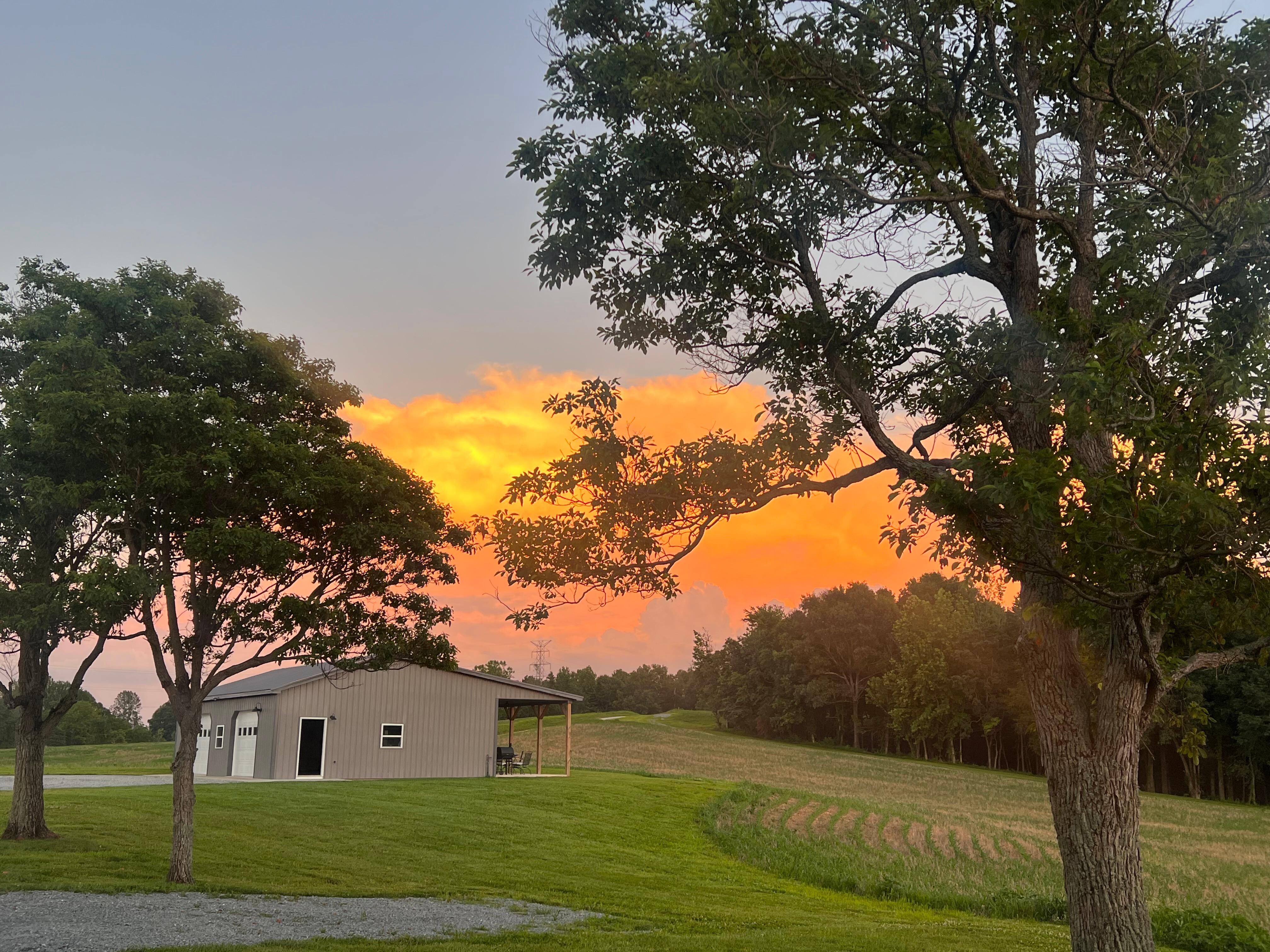 View of shed from house at sunset