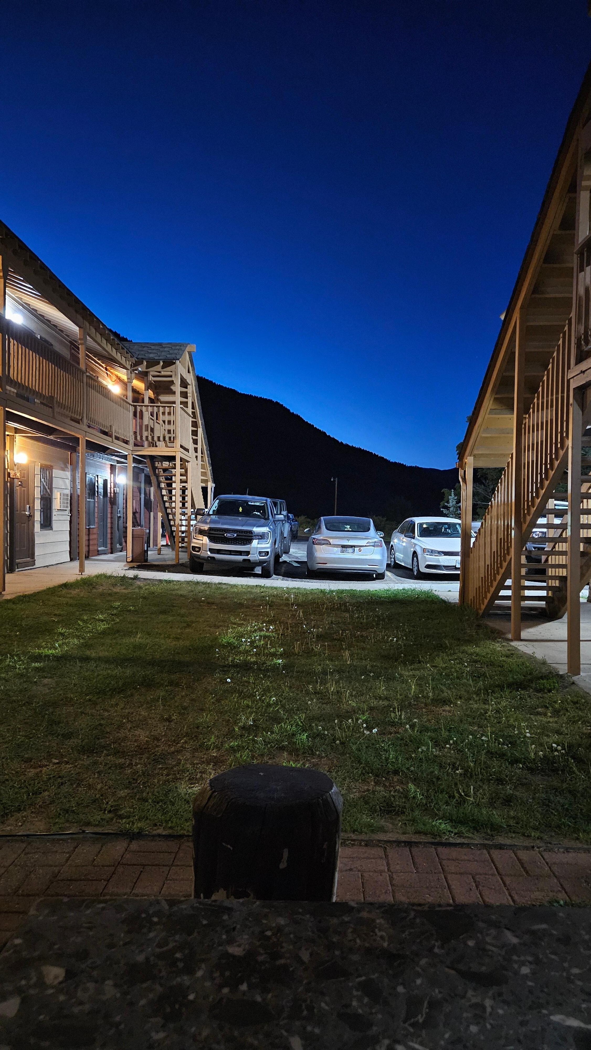 Outdoor area, had stump style seating around a flat, stone topped table. Stars visible at night too. 