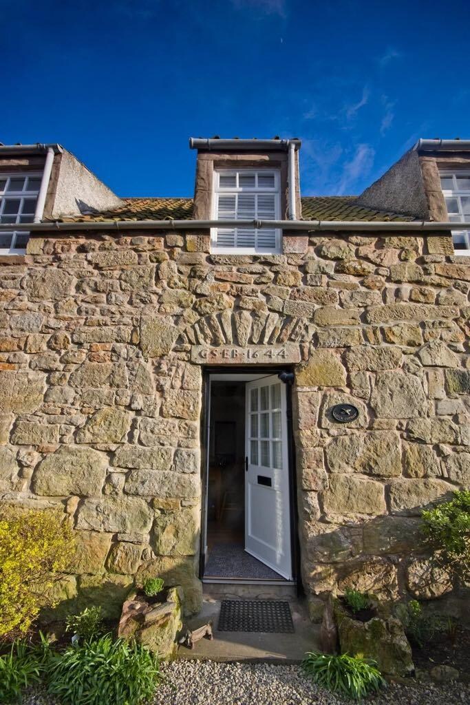Duck Cottage with marriage lintel from 1644. Not related to the house but is to the village. 