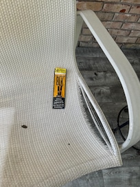Ripped lawn chairs and trash