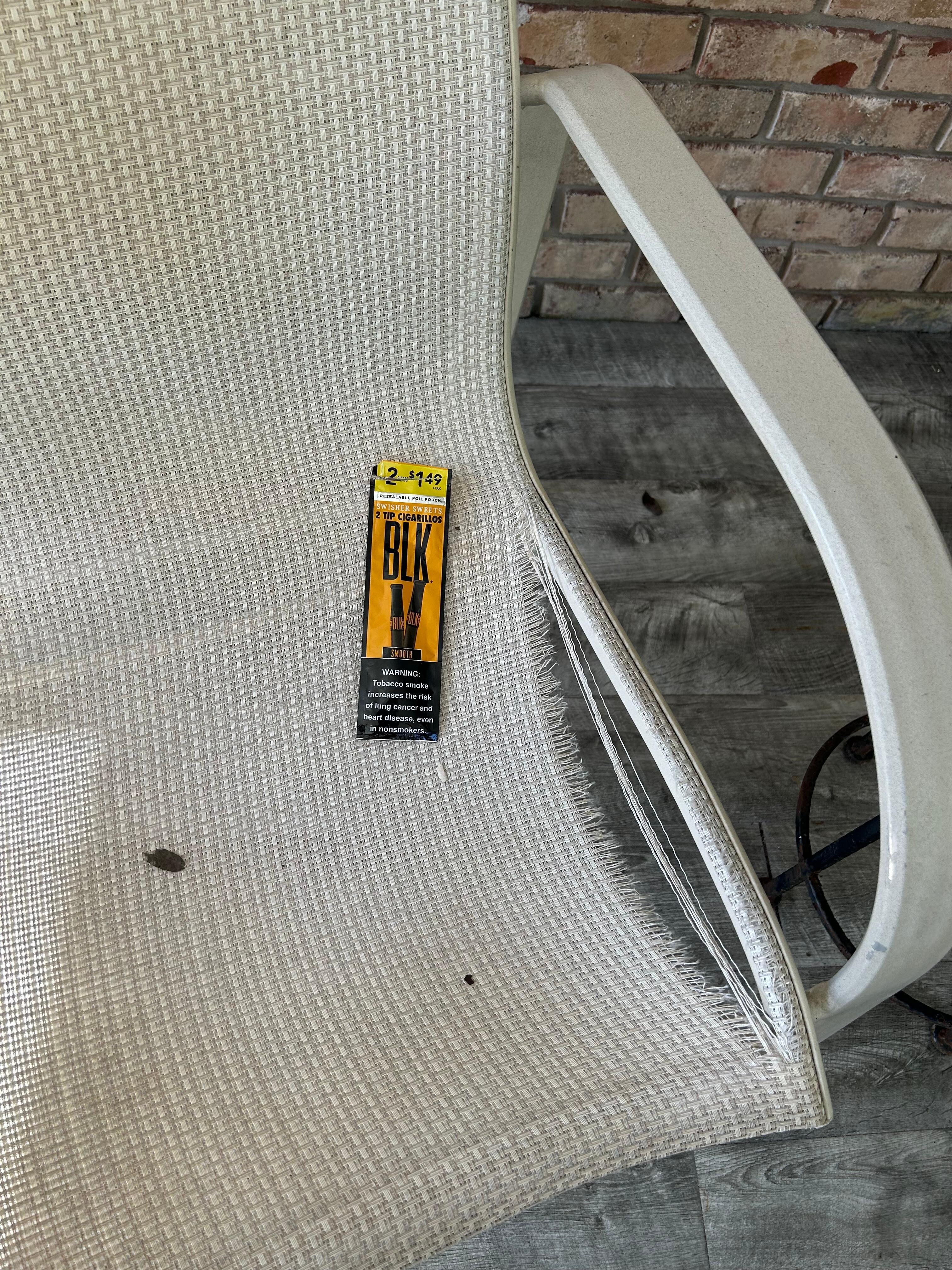 Ripped lawn chairs and trash