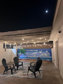 Patio at night off the garage
