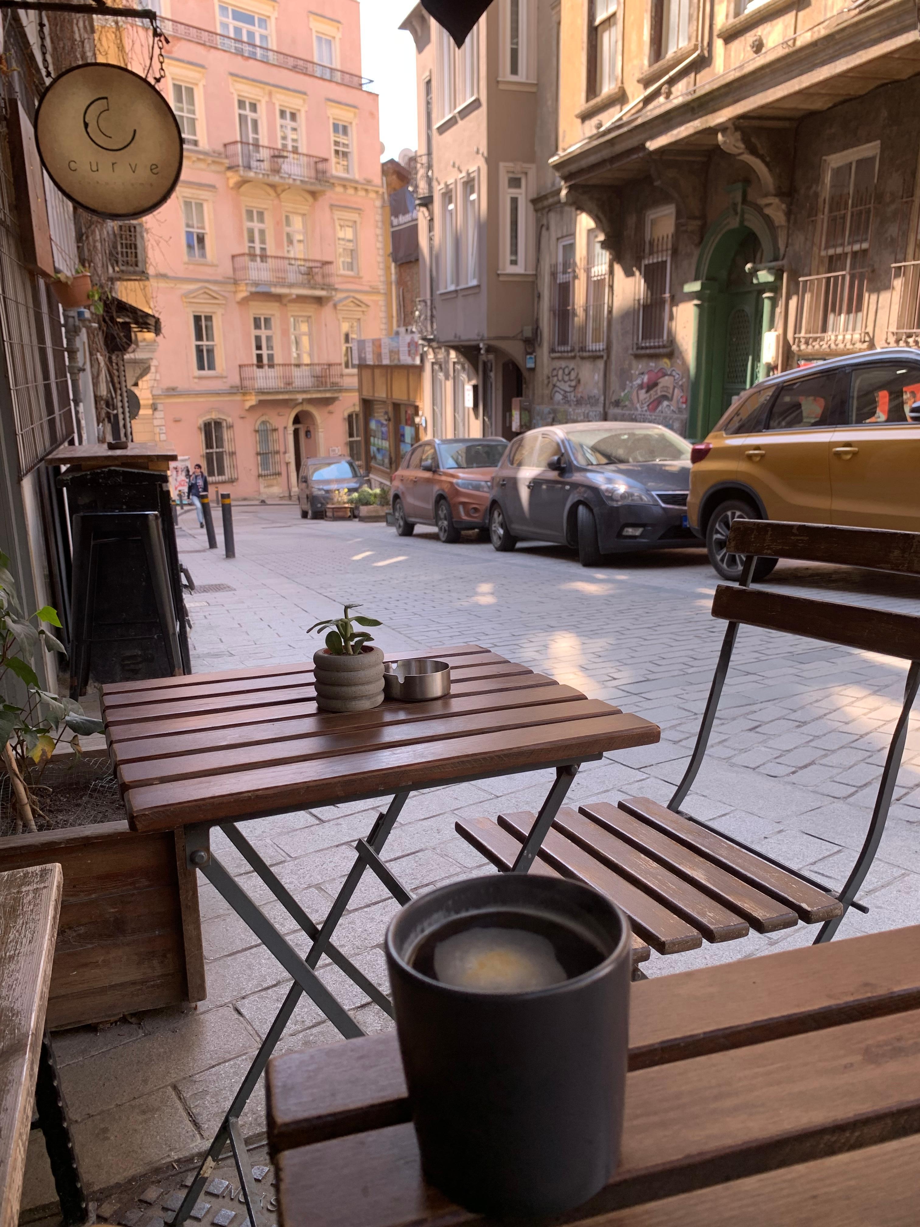 Enjoying a nice cup of freshly brewed coffee at a local cafe about 30 seconds from the apartment.