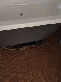 Instead of having a proper seal between electrical components of the tub and the rest of the room, they wrapped CARPET STRIPS around it!