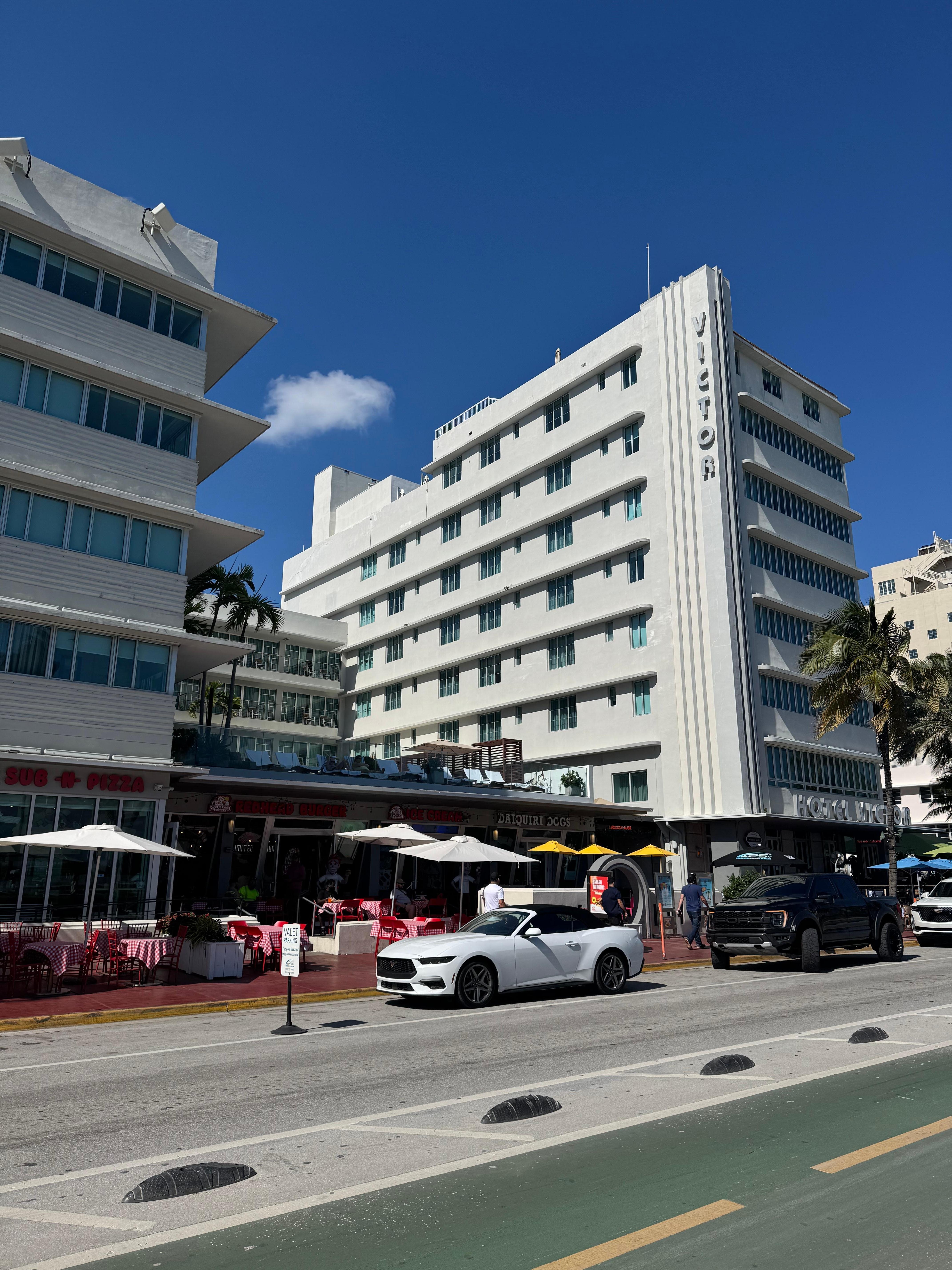 Front of Hotel with four tacky fast food places under the swimming pool.