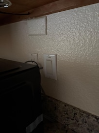 Kitchen light switch behind microwave