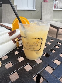 A gilded cocktail by the pool