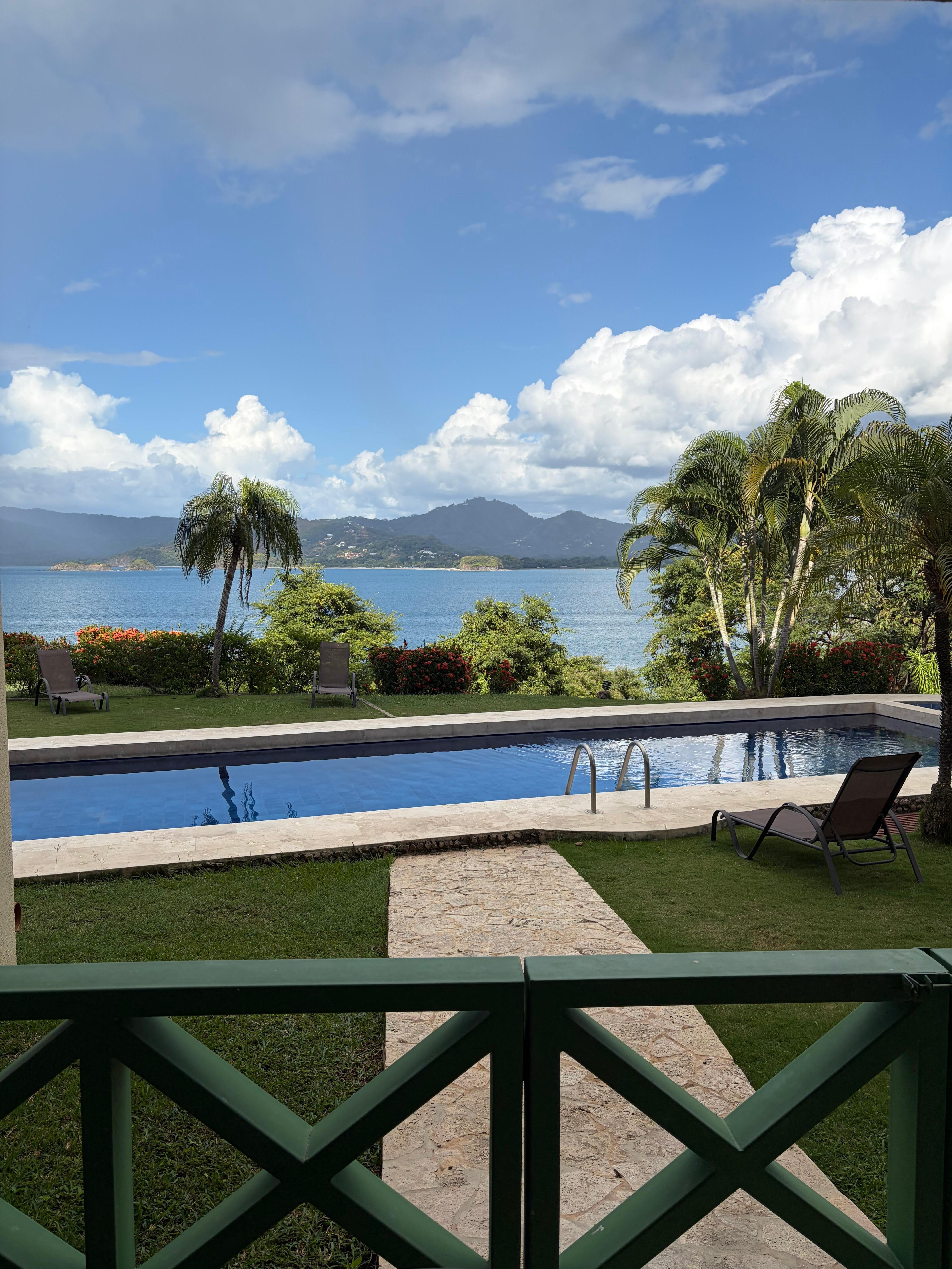 View from the porch. Shared pool and view of the bay. 