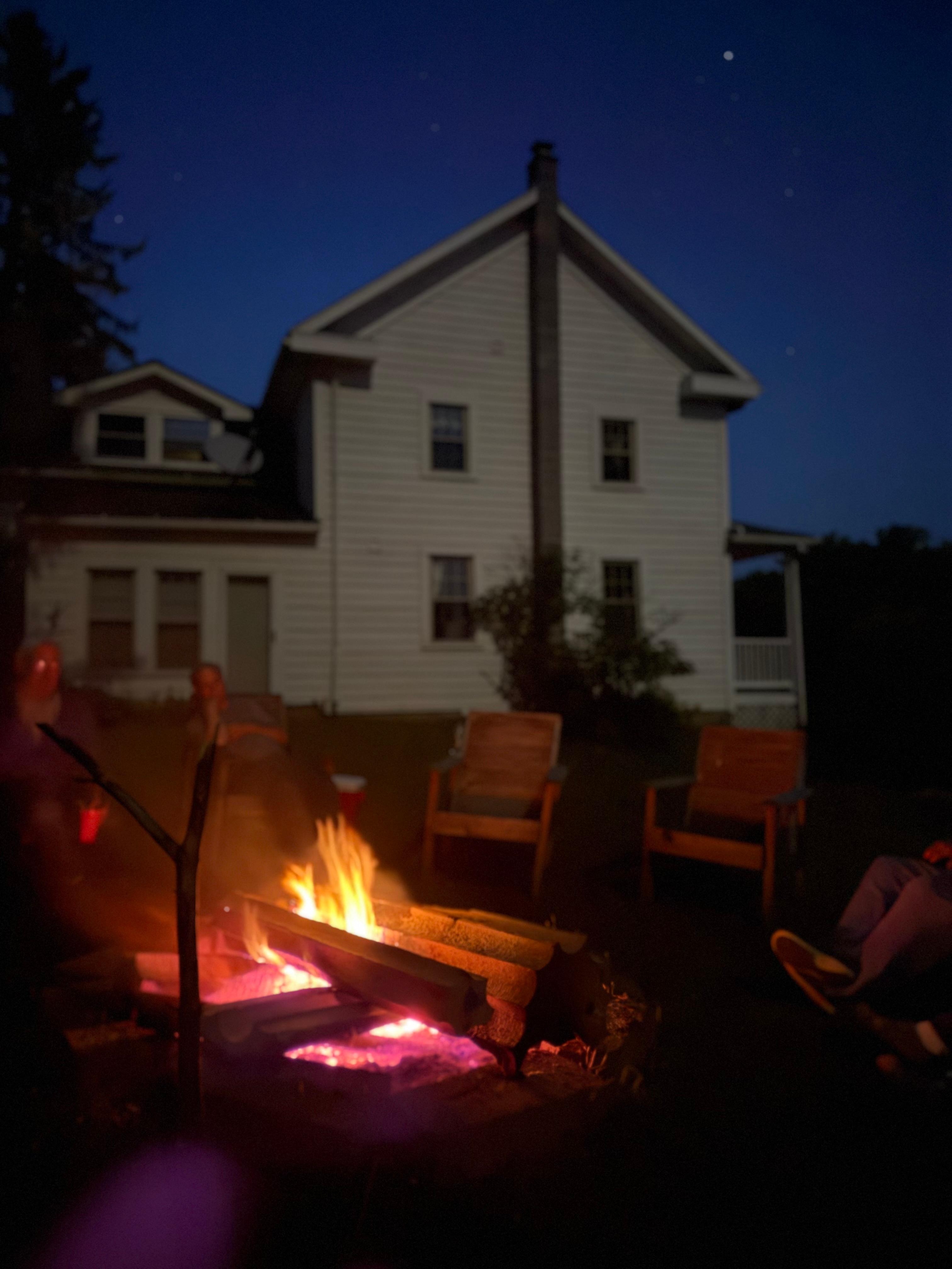 The farmhouse at night being lit up by the moon 