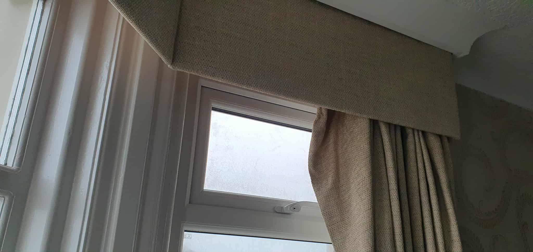 Curtains hanging off.