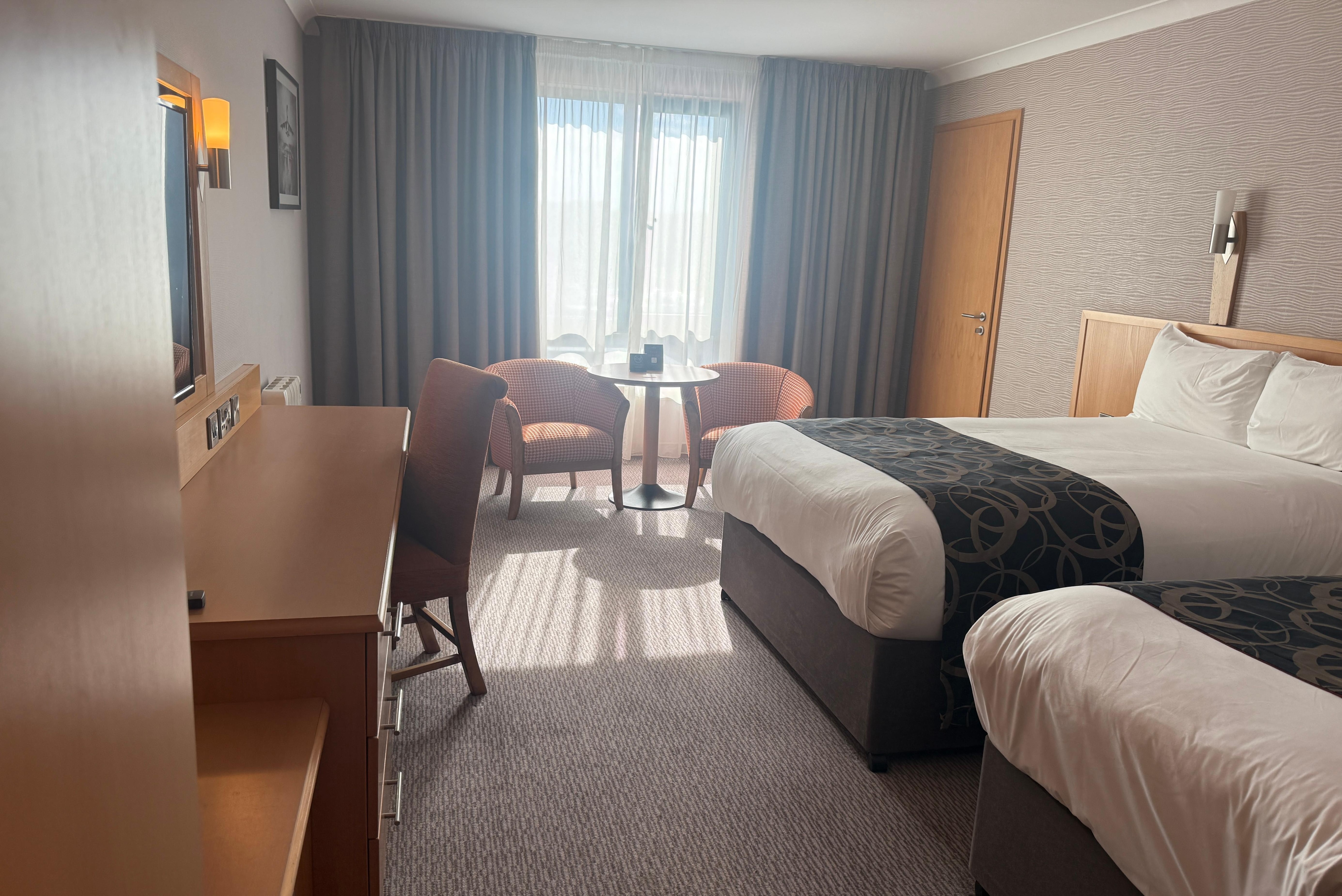 Room with a double and single bed layout.