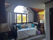 Primary bedroom’s additional daybed