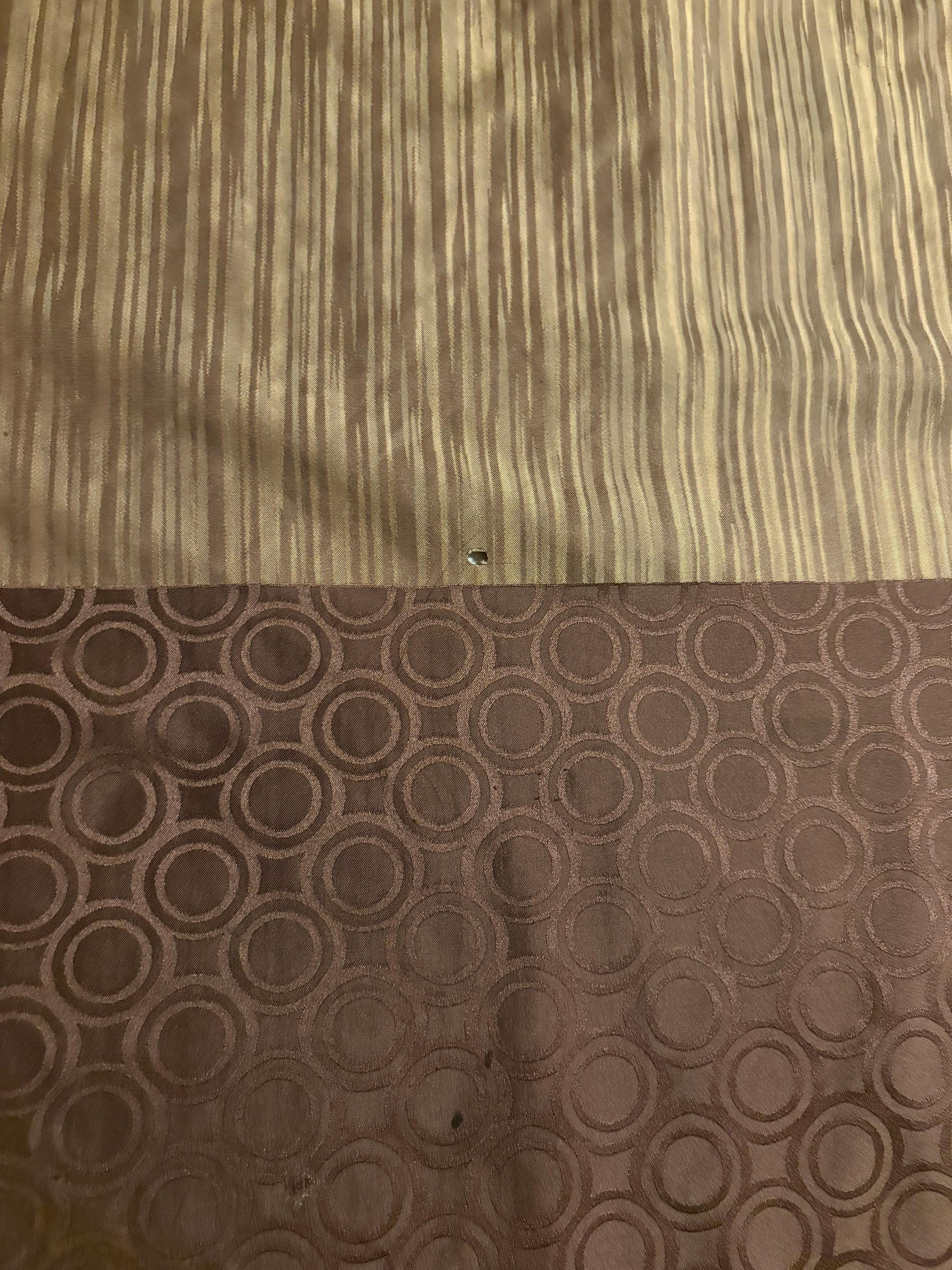 Cigarette burn on bottom portion of bed cover (bed 2)