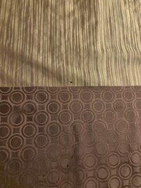 Cigarette burn on bottom portion of bed cover (bed 2)