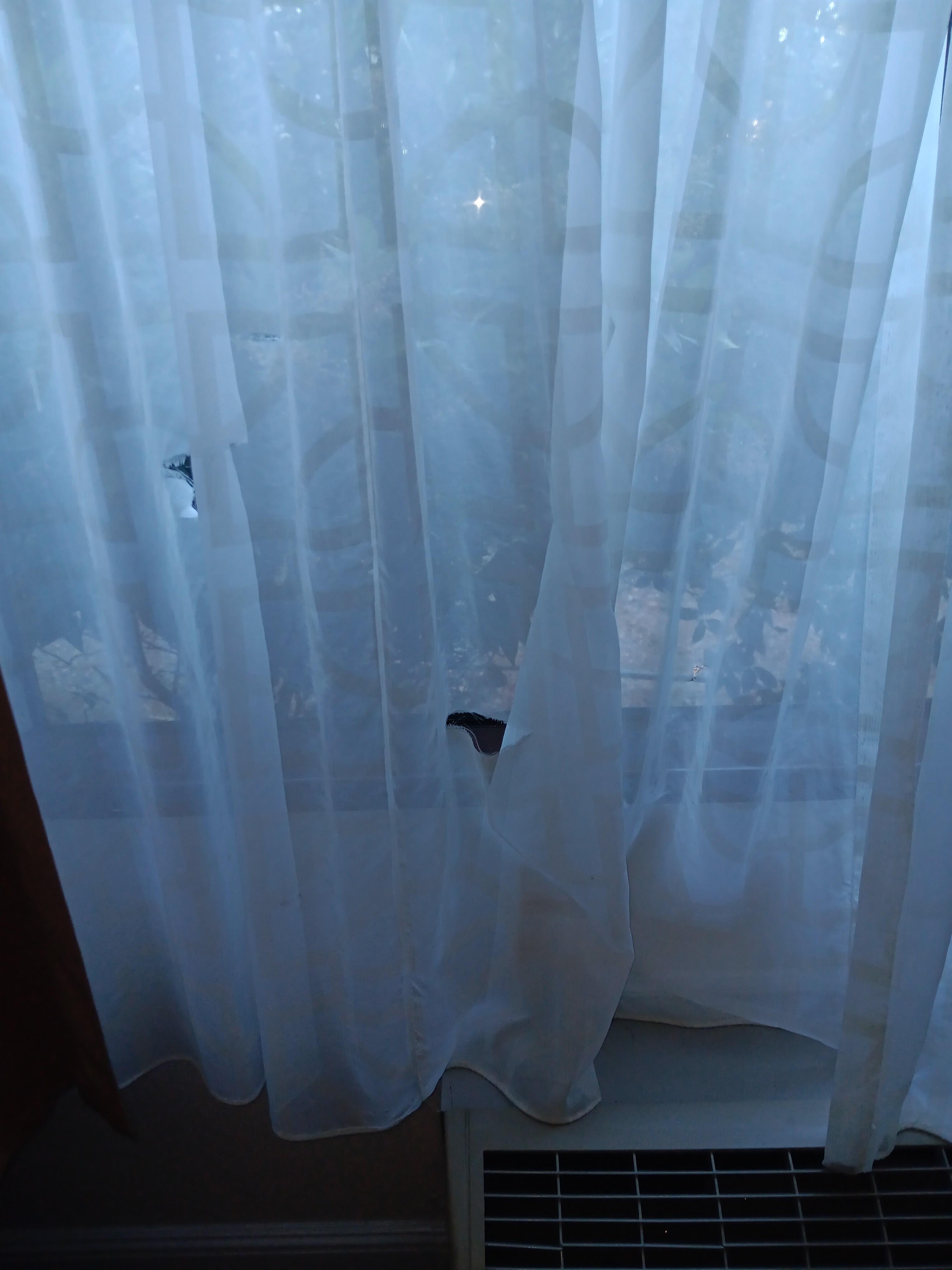 Hole in curtains