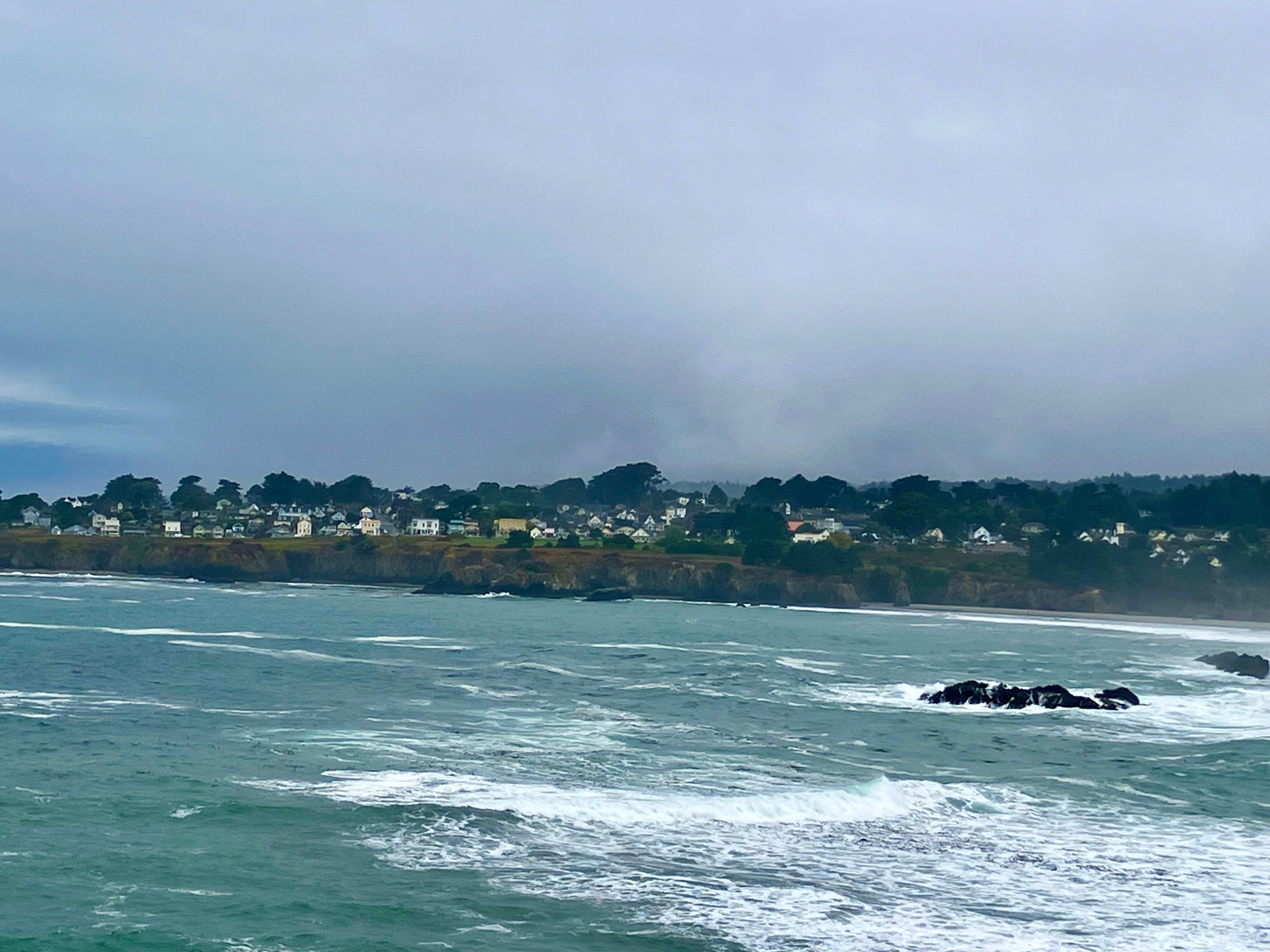 View across the bay of the lovely town of Mendocino where you can wander into unique shops & eat at incredible restaurants.