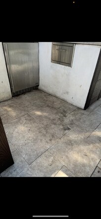 Dirty barbecue area & broken outdoor refrigerator