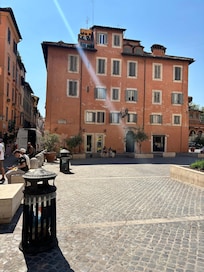 Looking from the square to the first floor corner apartment.