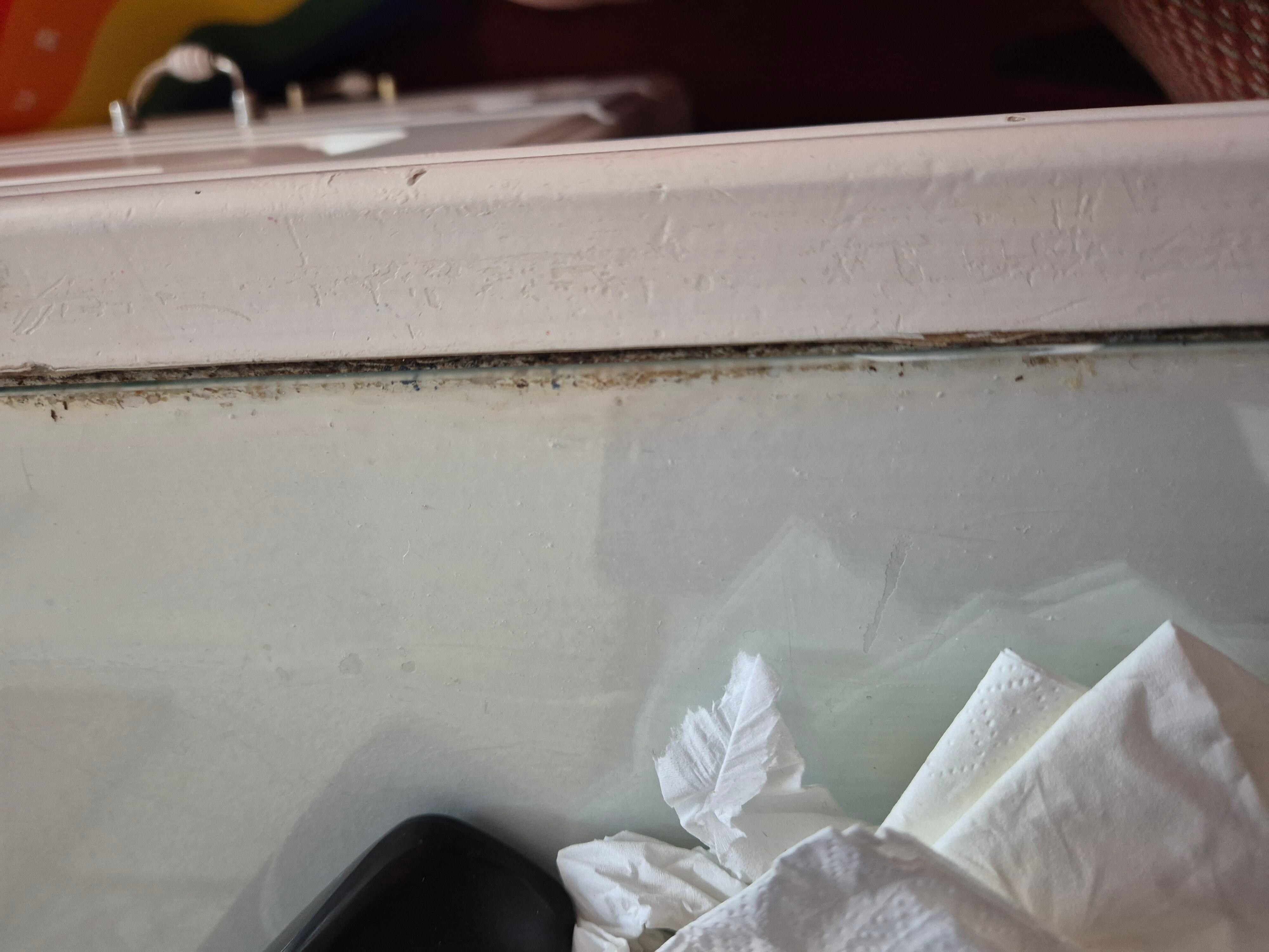 Dirty under glass on dressing table