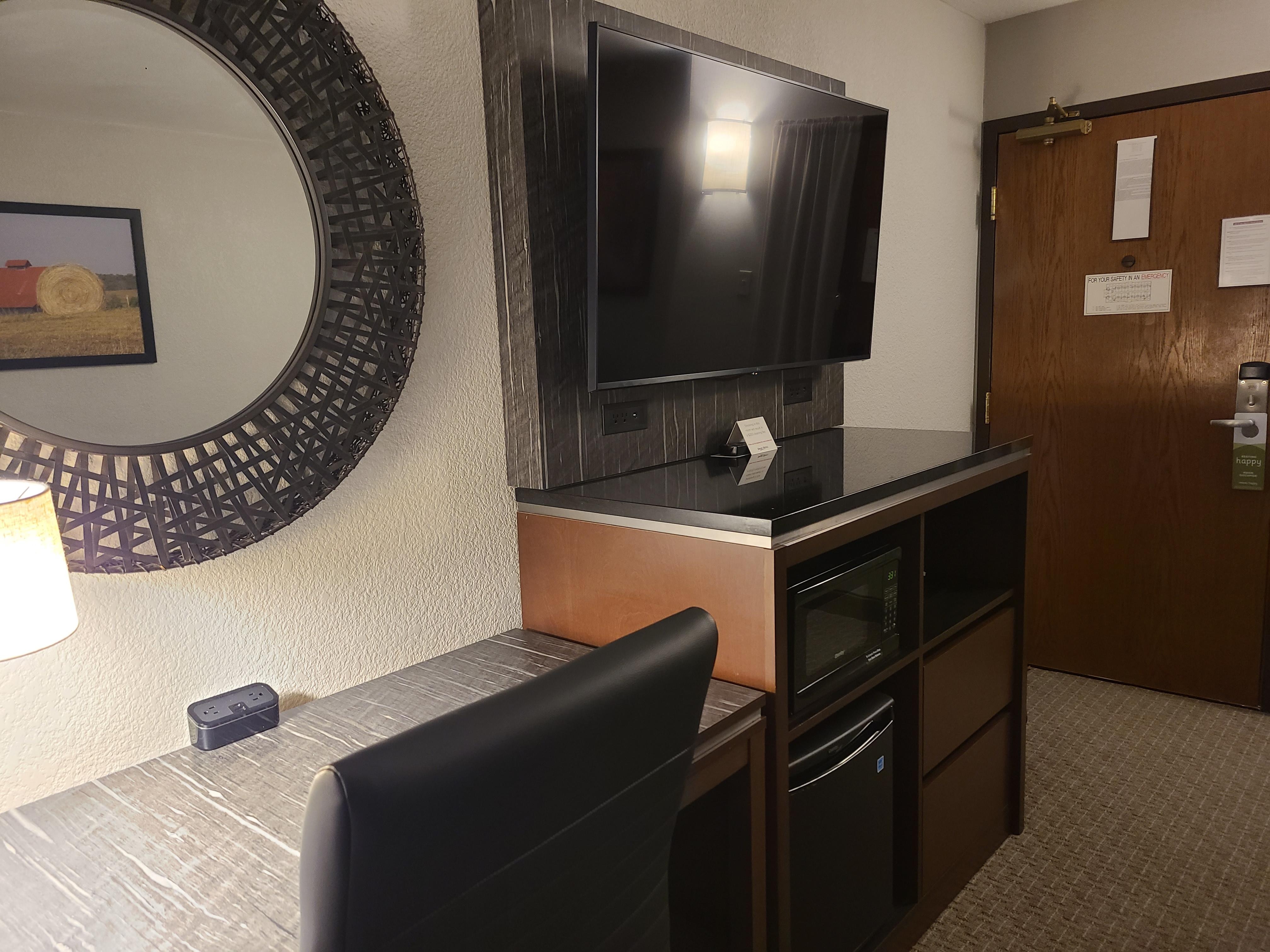 Desk, microwave and fridge in the living room